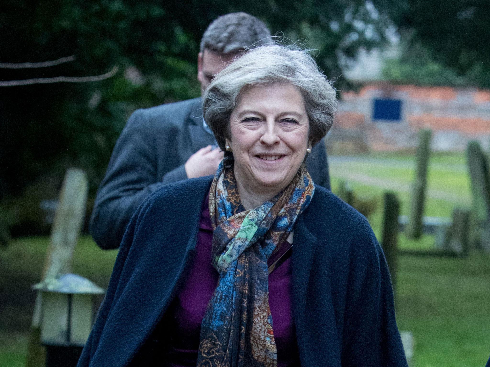 Theresa May pictured on Christmas Day attending a service at St Andrew's Church