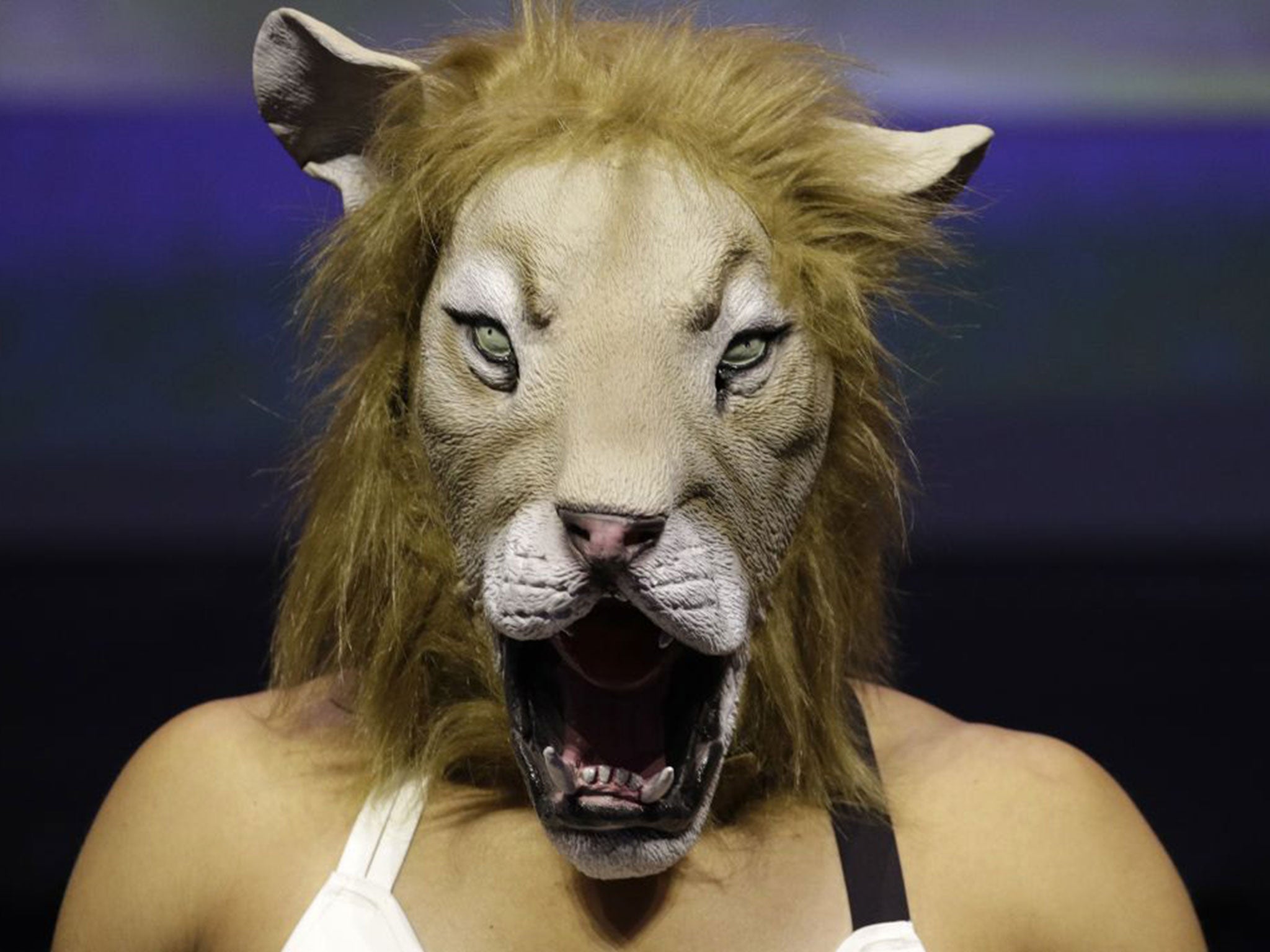 Nunes took to the scales wearing a lion mask before staring down Rousey