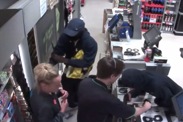 CCTV footage released by police shows two men armed with a black pistol and a kitchen knife enter a Co-op in Eltham, south-east London, and threaten two members of staff as they take money from the till and steal other goods from behind the till