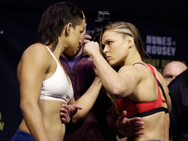 Ronda Rousey and Amanda Nunes face off at the UFC 207 weigh-in