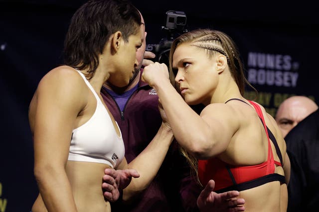 Ronda Rousey and Amanda Nunes face off at the UFC 207 weigh-in