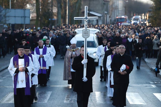 Mourners attend the funeral of Lukasz Urban, the Polish lorry driver who was killed in the Berlin Christmas market attack, in Banie, Poland, on 30 December