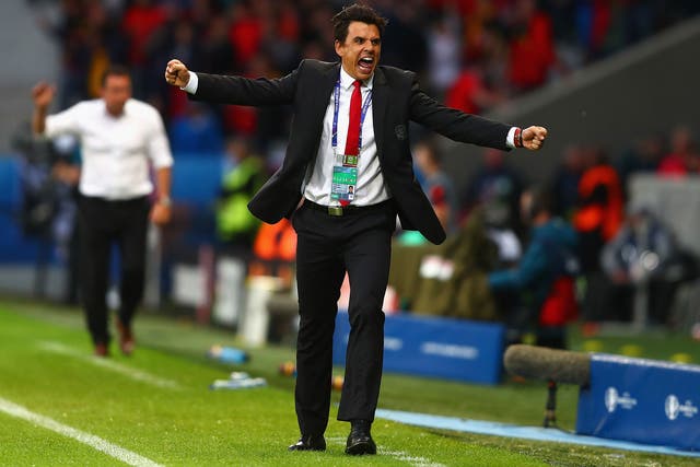 Chris Coleman celebrates on the sideline during Wales' historic victory over Belgium at Euro 2016