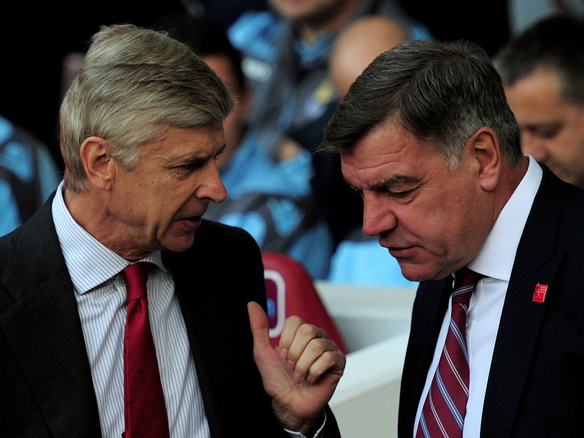 Arsene Wenger and Sam Allardyce exchange a quick before kick-off in Arsenal's game against West Ham, 2012