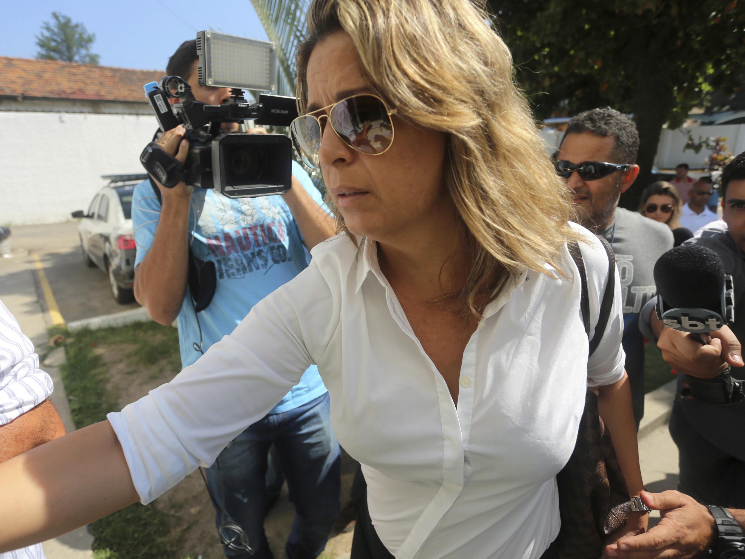Francoise Amiridis, the wife of Greece's Ambassador to Brazil Kyriakos Amiridis, arrives at a police station to be interrogated in connection with her husband's disappearance in Belford Roxo (AP )