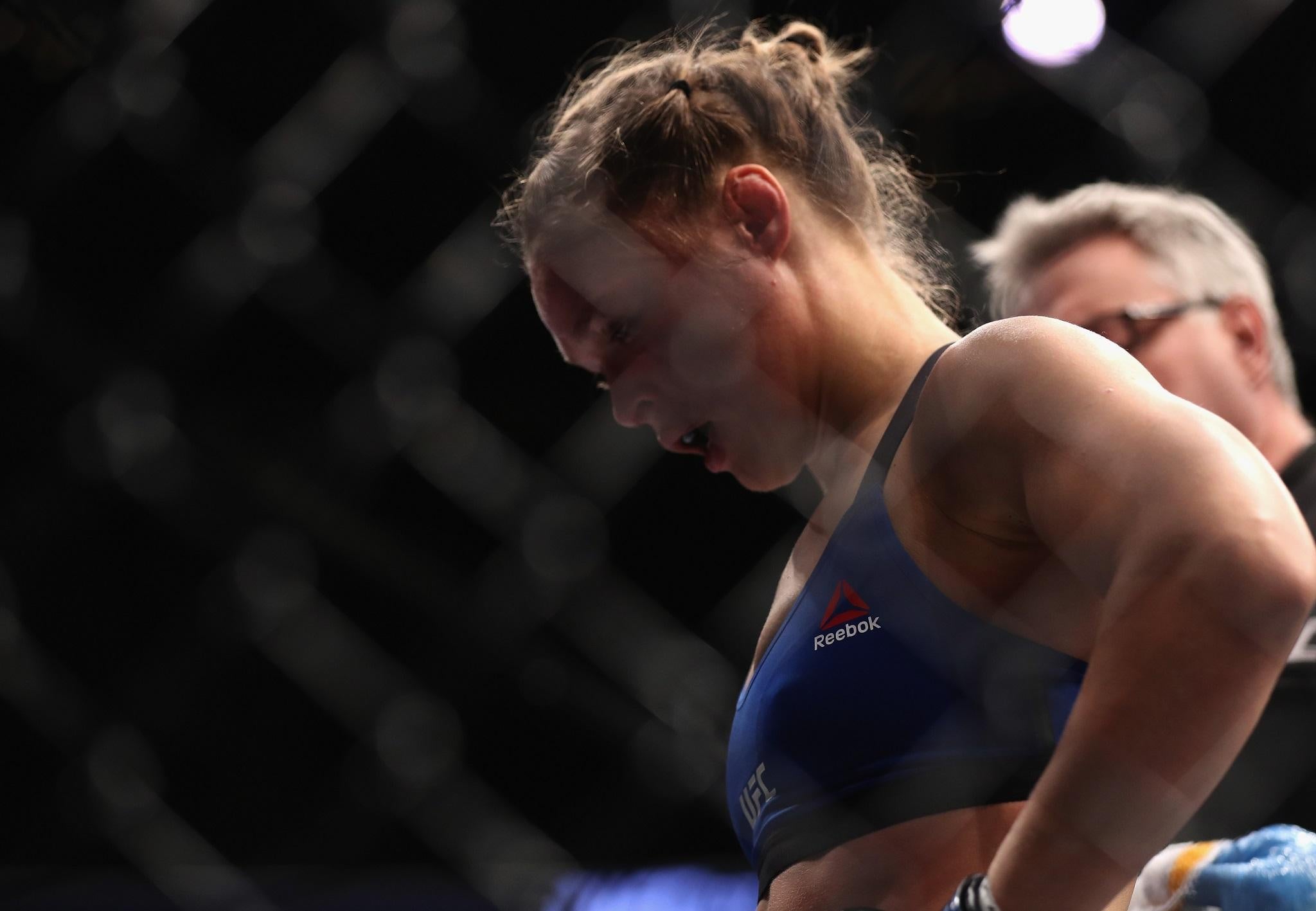 Ronda Rousey appears dejected after her 48-second defeat at UFC 207 to Amanda Nunes