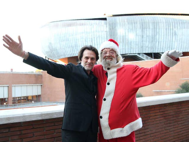 The theatre's new orchestral director, Marco Dallara, was pictured alongside Father Christmas