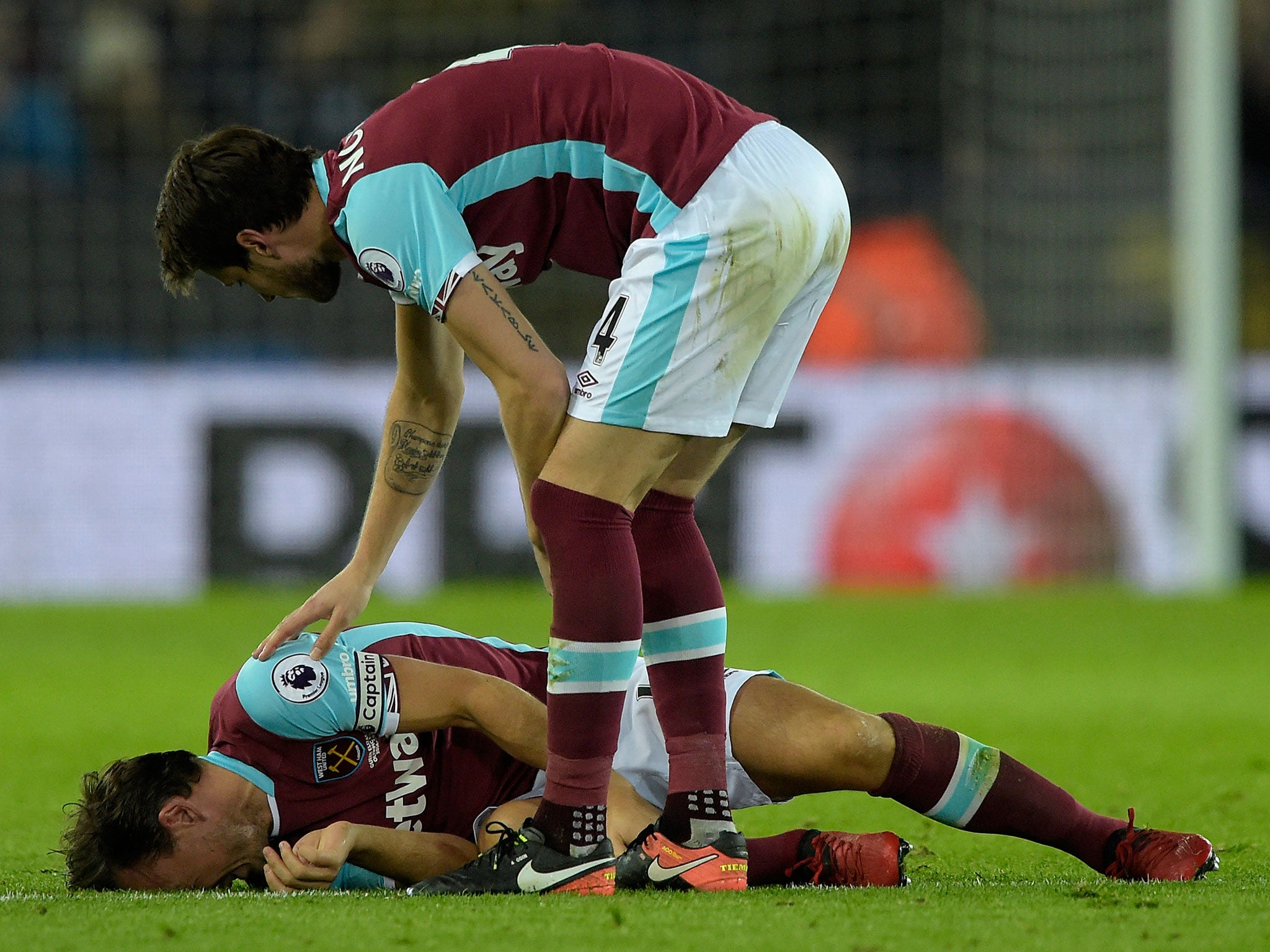 Mark Noble is left in agony on the pitch