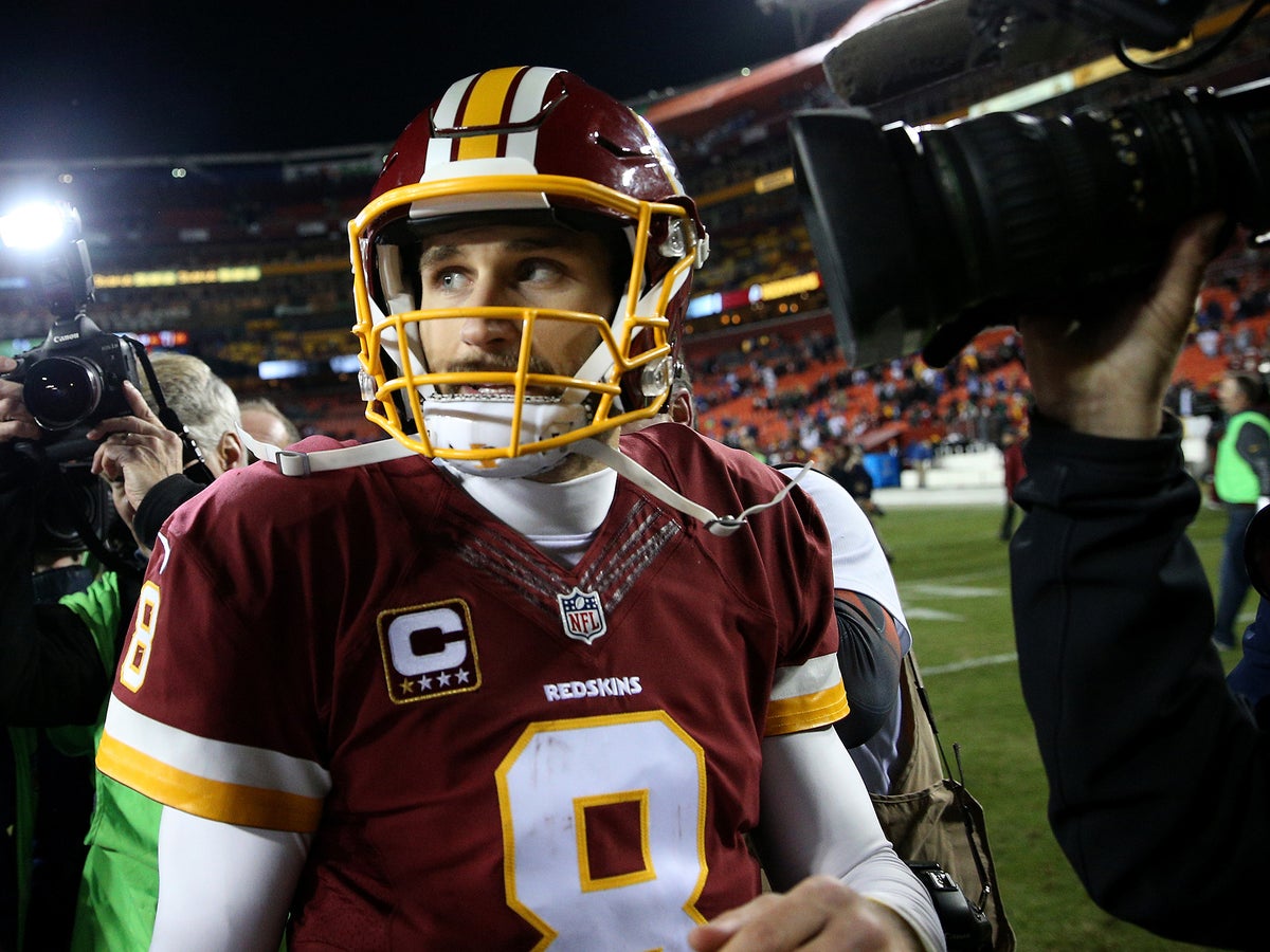 Washington Redskins quarterback Kirk Cousins (8) throws the ball as he  warms up before an NFL game against the Atlanta Falcons at the Georgia Dome  in Atlanta on Sunday, Oct. 11, 2015. (