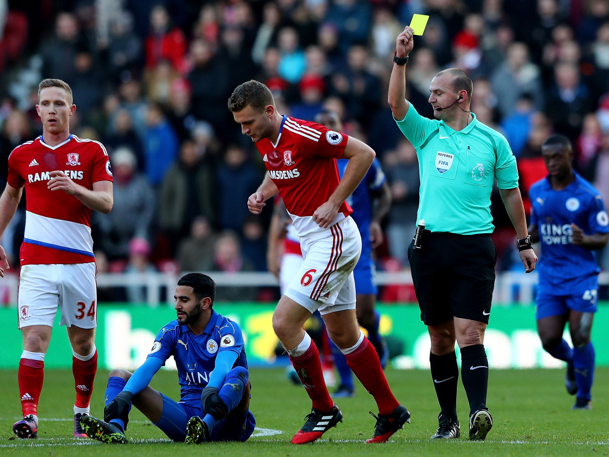 Ben Gibson is shown yellow by referee Robert Madley