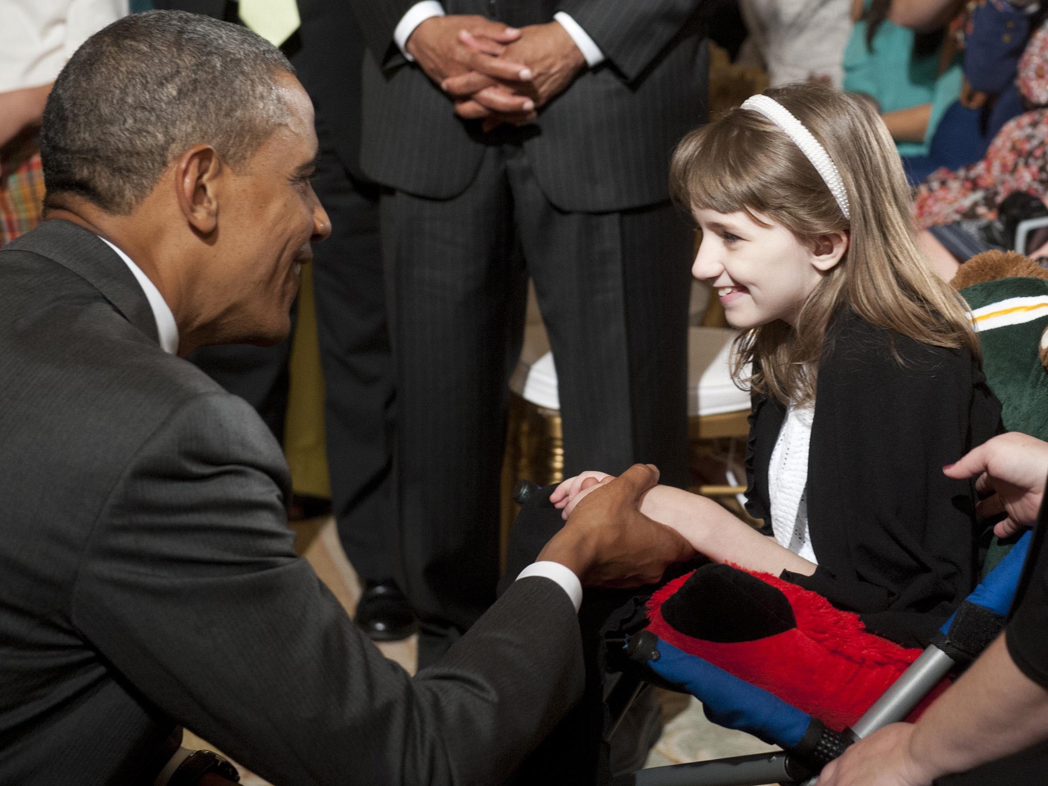 US President Barack Obama greets 11-year-old Haley Klepper during a ceremony honouring the 2012 NCAA Women’s College Basketball Champion Baylor Bears in 2012. Klepper, who suffers from a rare mitochondrial disease, calls herself the team’s ‘biggest fan’