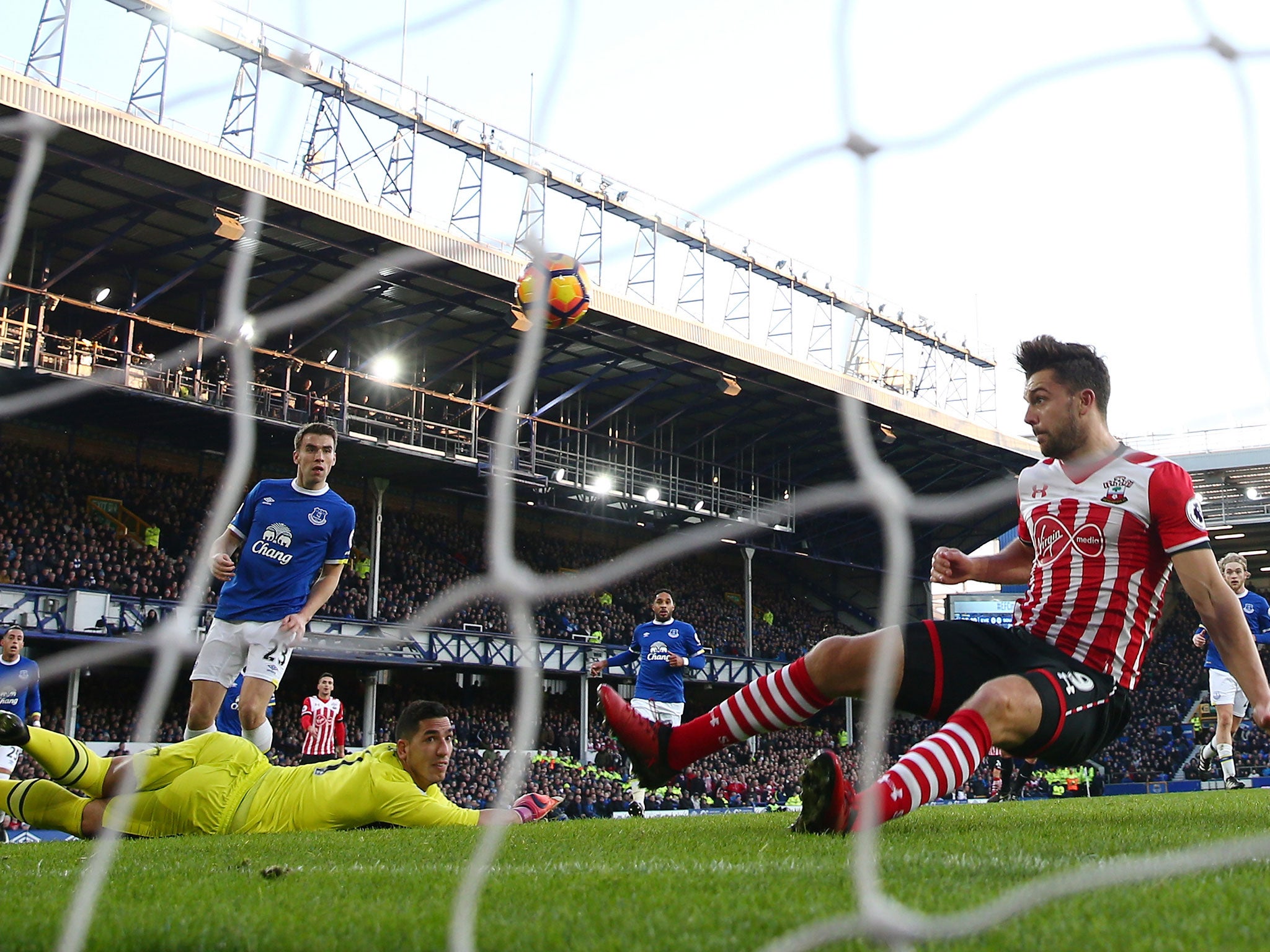 Goalkeeper Joel Robles watches as Jay Rodriguez attempts to head the ball in - but misses