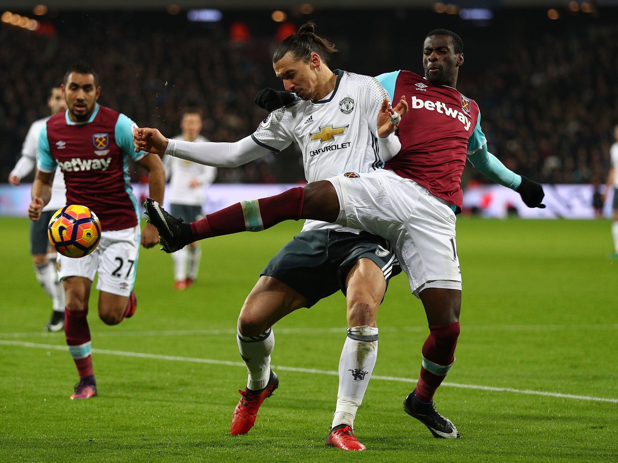 Pedro Obiang and Zlatan Ibrahimovic wrestle for the ball