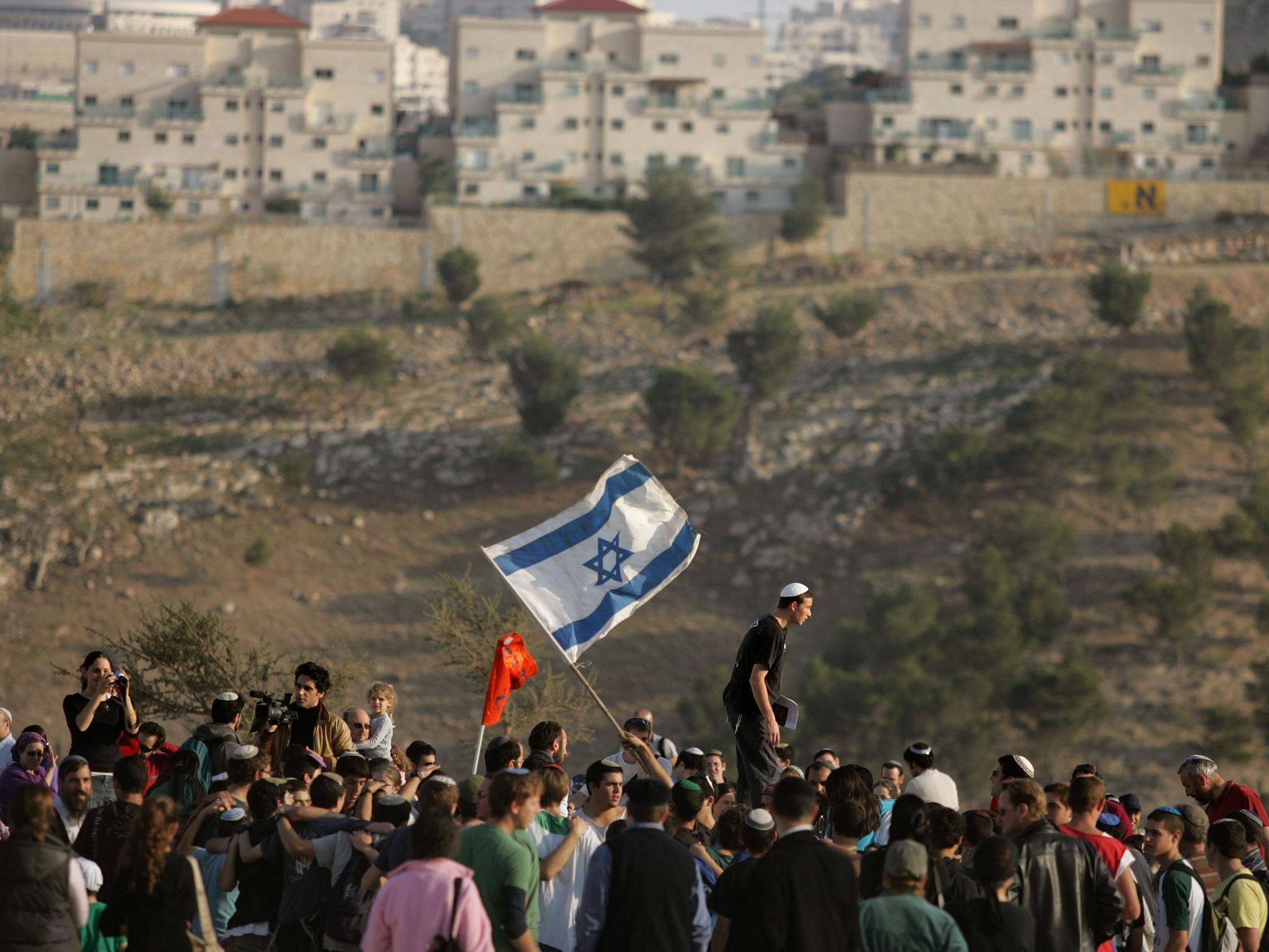 Israeli settlers dance and sing near the Israeli settlement of Maale Adumim in the West Bank (file photo)