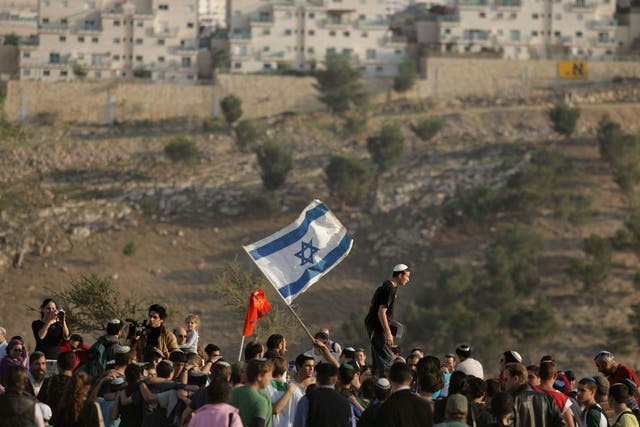 Israeli settlers dance and sing near the Israeli settlement of Maale Adumim in the West Bank (file photo)