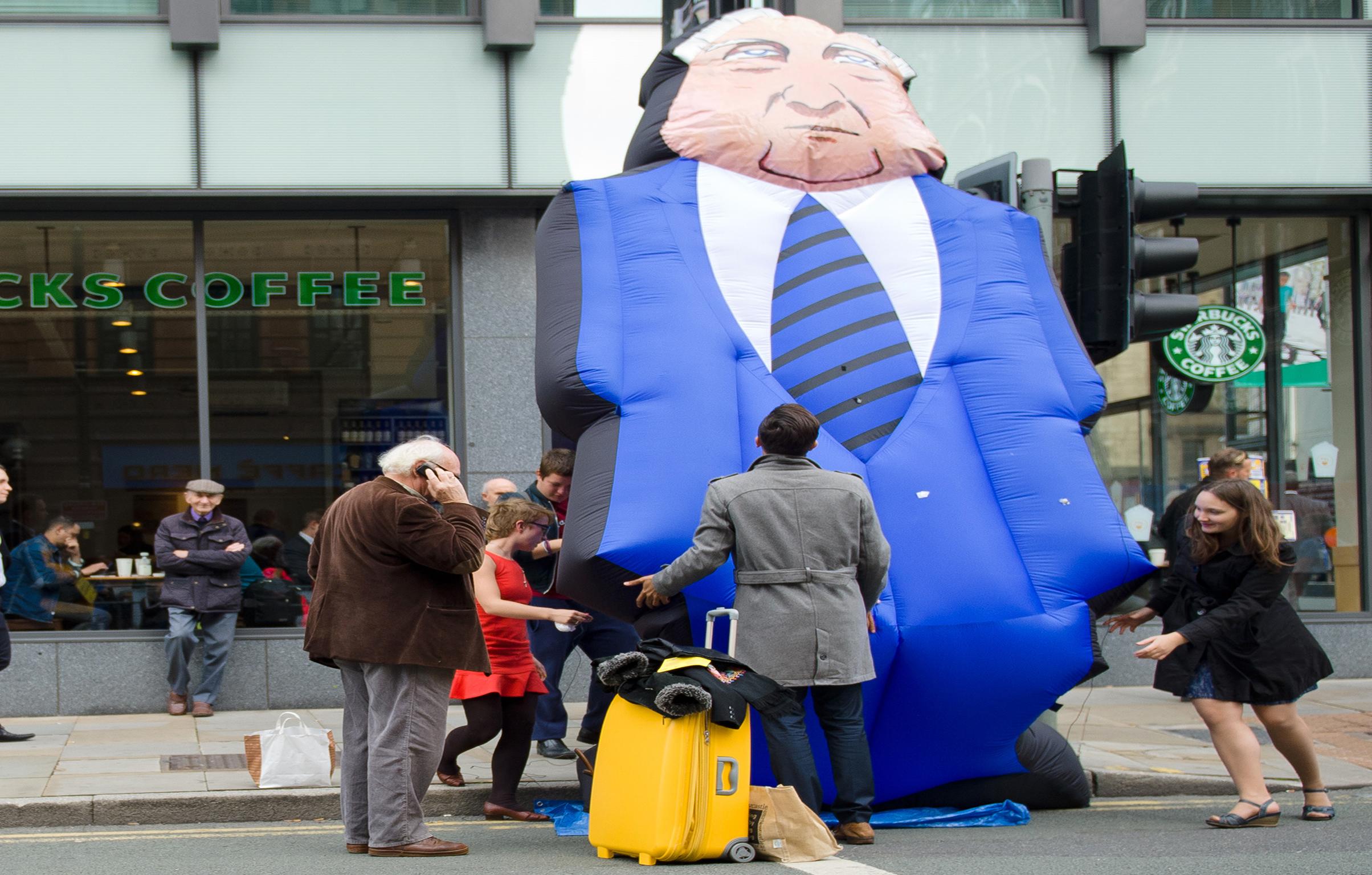 Protesters highlight the gap between ‘fat cat’ executives and normal staff