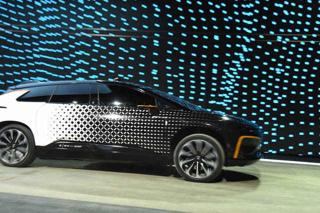 Faraday Future's FF 91 prototype electric crossover vehicle is shown during a speed test as it is unveiled during a press event for CES 2017 at The Pavilions at Las Vegas Market on January 3, 2017 in Las Vegas, Nevada