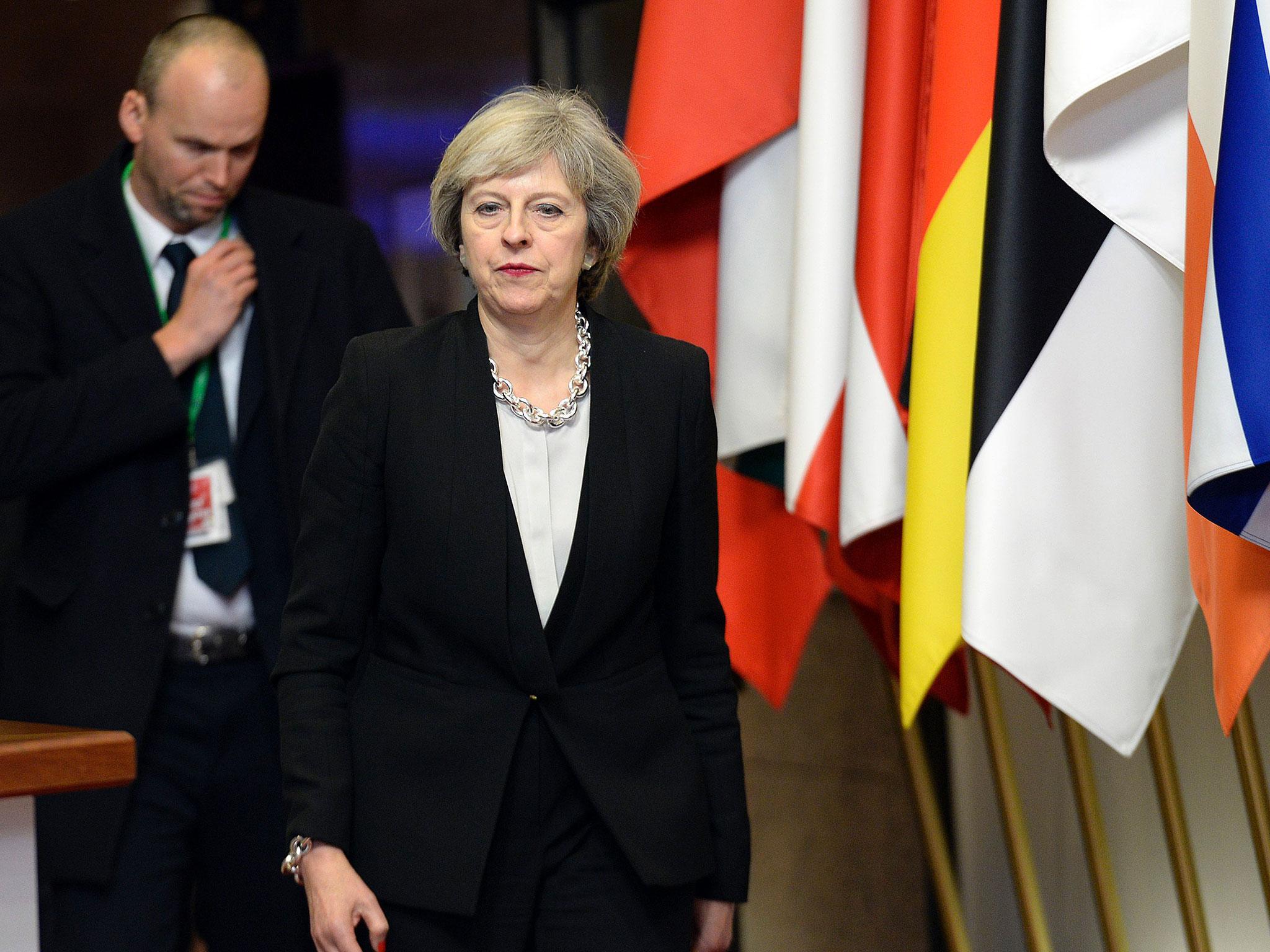 British Prime Minister Theresa May leaves at the end of a European Union Summit held at the EU Council building in Brussels on December 15, 2016. EU leaders agreed to extend for another six months damaging economic sanctions imposed on Russia for its role in the Ukraine crisis, diplomatic sources said