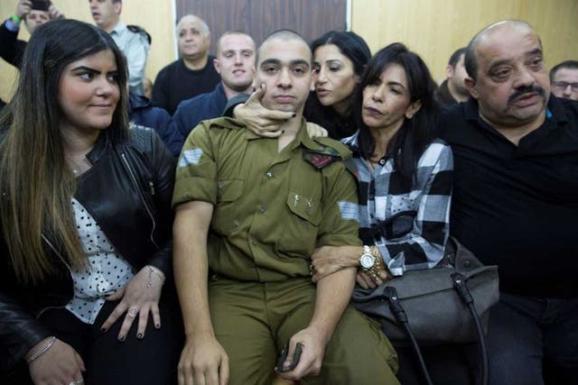 Elor Azaria with his family in court (Reuters)