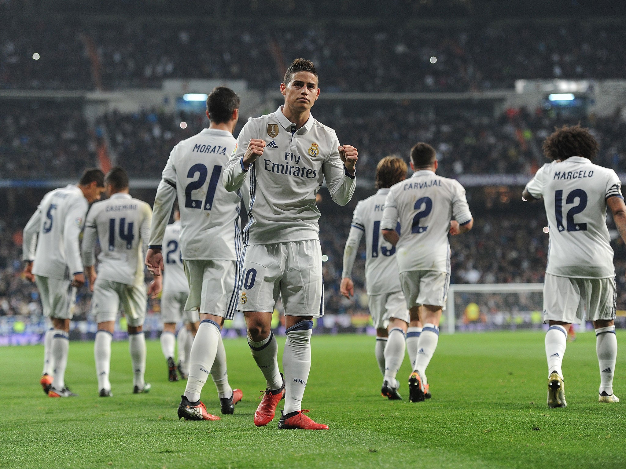 James Rodriguez celebrates after scoring his side's third goal