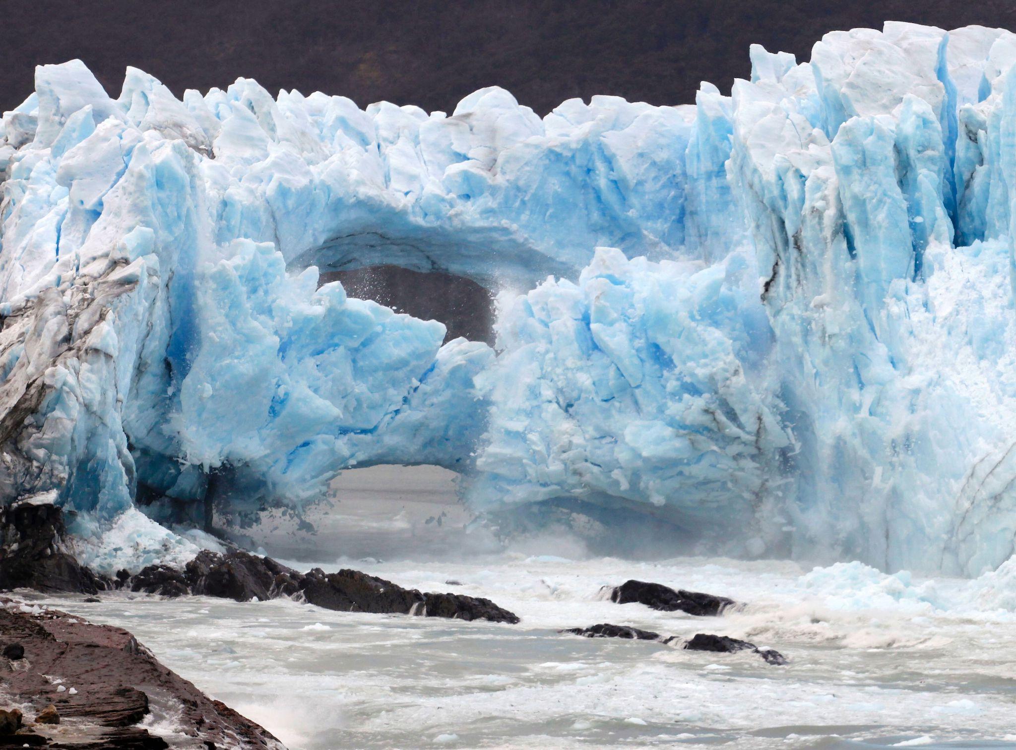 Ice cracks from the wall of the Perito Moreno Glacier in Los Glaciares National Park, Argentina