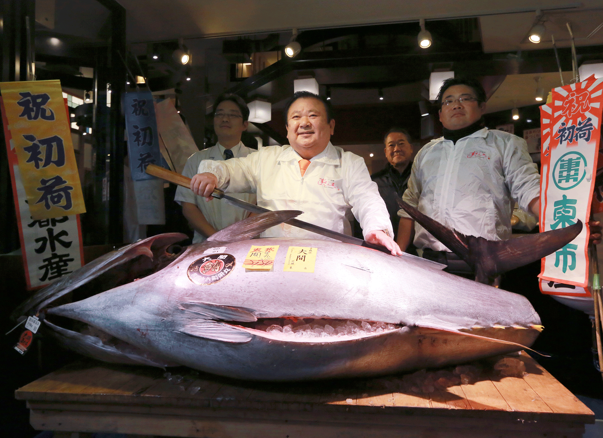 Kiyomura owner Kiyoshi Kimura posed, beaming, after the predawn New Year auction with the gleaming, man-sized fish
