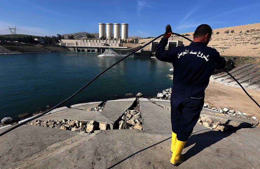 An employee works on strengthening the Mosul Dam on the Tigris River, north of the Iraqi city of Mosul, on February 1, 2016