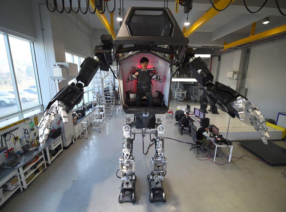 Engineers test a four-metre-tall humanoid manned robot dubbed Method-2 in a lab of the Hankook Mirae Technology in Gunpo, south of Seoul, on December 27, 2016