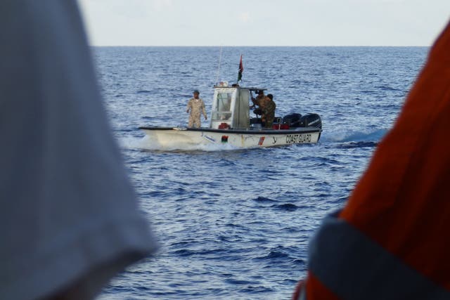 A Libyan coastguard boat observing a rescue by MSF's Bourbon Argos ship on 4 November 2016