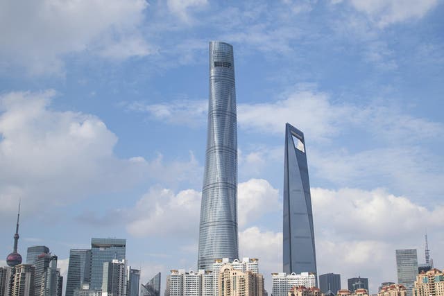 The Shanghai Tower (centre) holds the record for the fastest lift in the world. Companies have been rushing to service China’s many towering structures