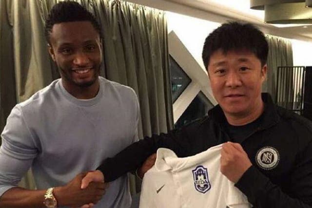 John Obi Mikel was pictured shaking hands with Tianjin official on social media