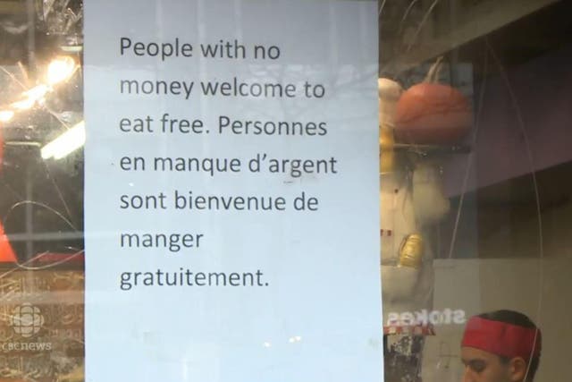 The sign outside Marche Ferdous in Montreal offering free food to those who need it