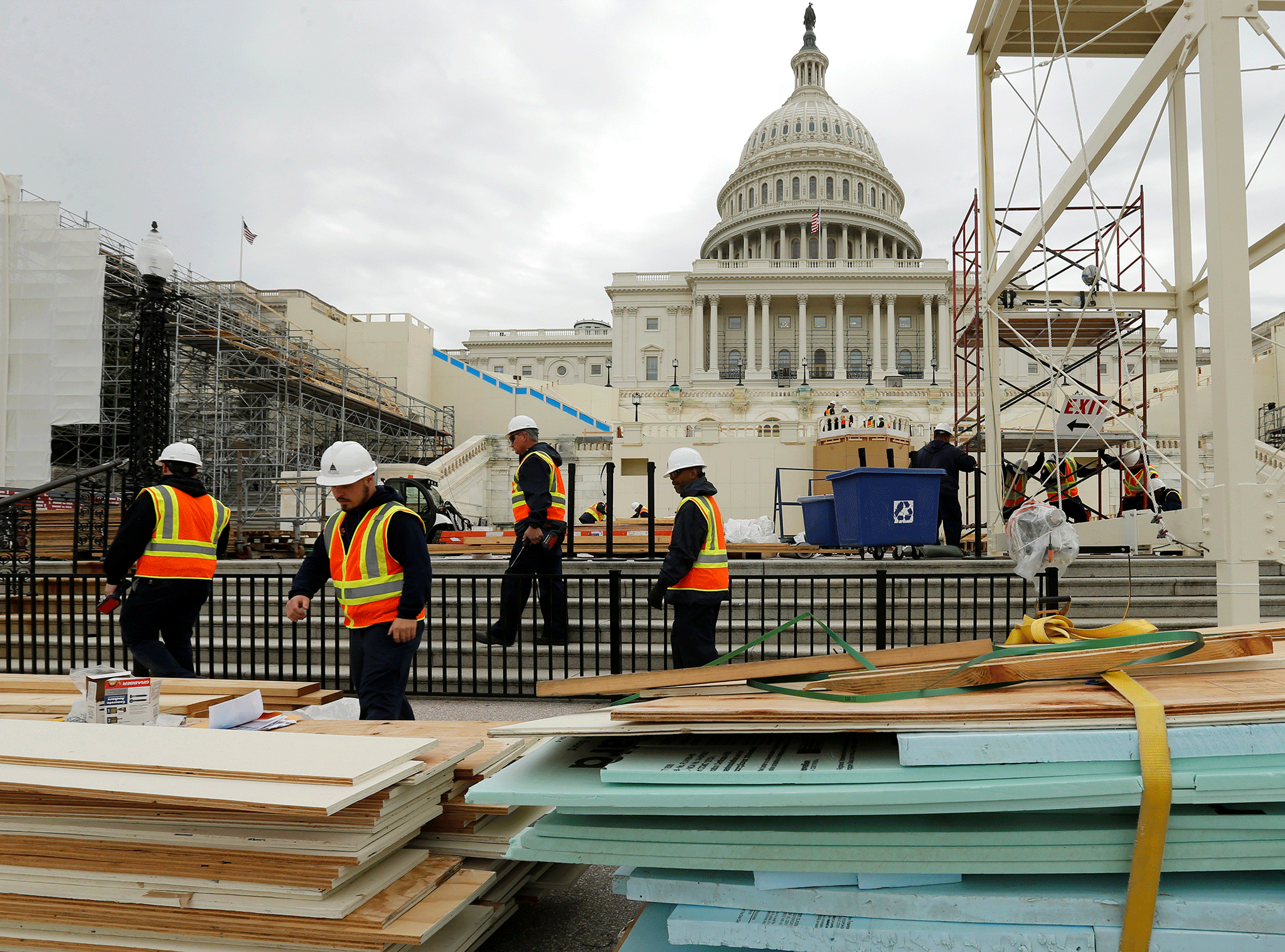 Workers construct the viewing stands ahead of Trump's inauguration at the U.S. Capitol in Washington