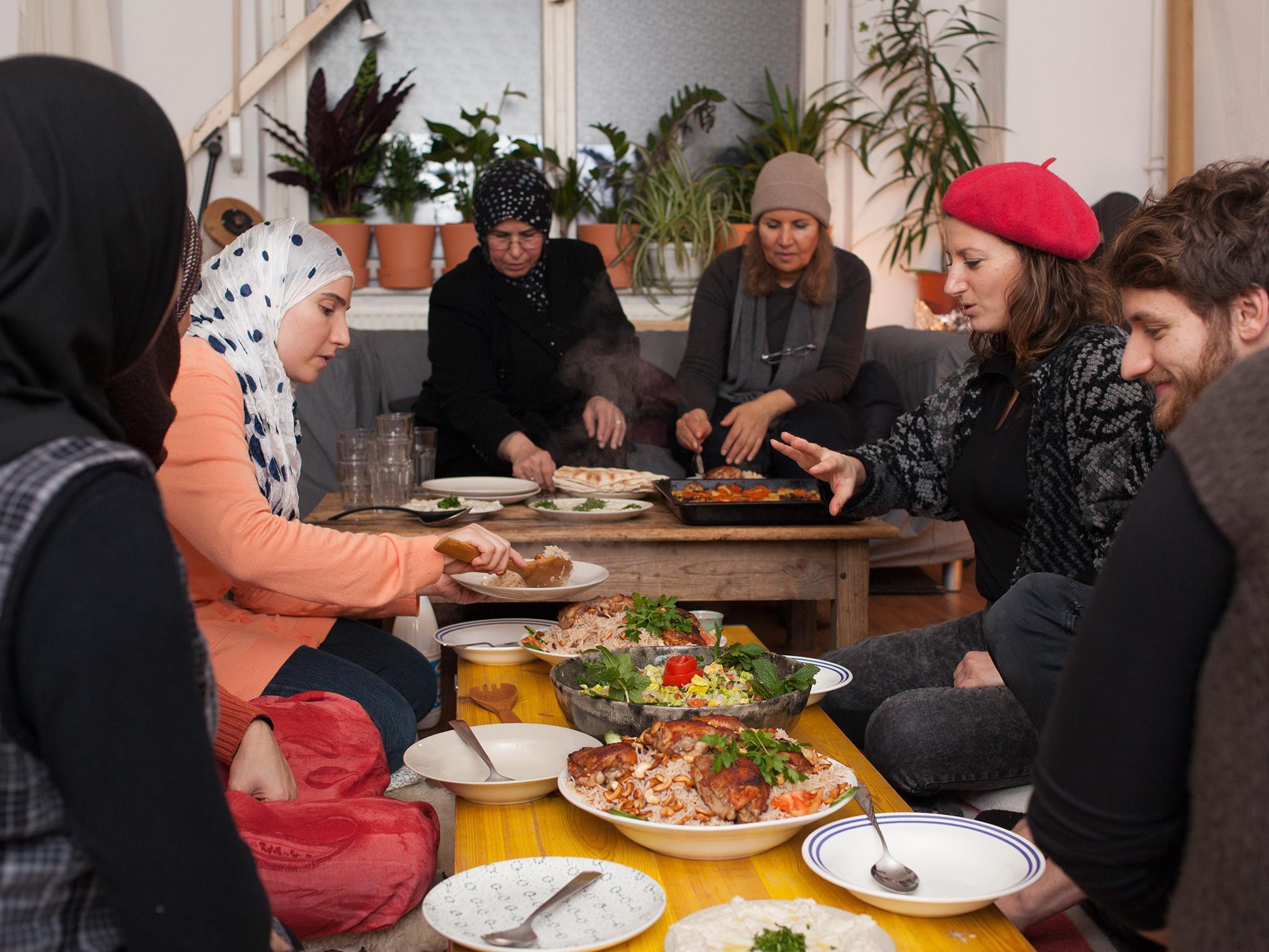 The dinners also give Berliners a chance to learn about their city’s new residents