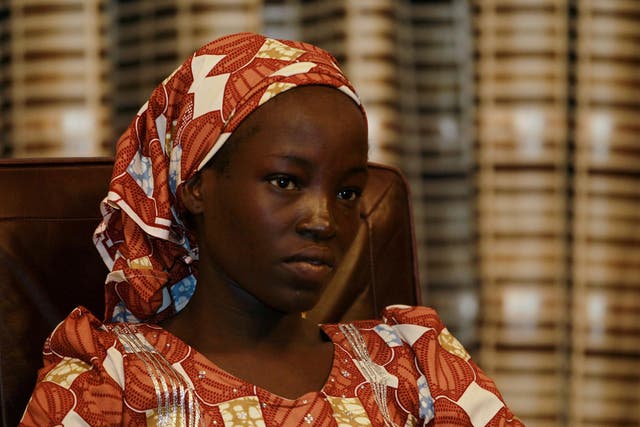 Amina Ali Darsha Nkeki, a Nigerian schoolgirl rescued after over two years of captivity with Boko Haram militants, looks on while visiting President Muhammadu Buhari in Abuja, Nigeria