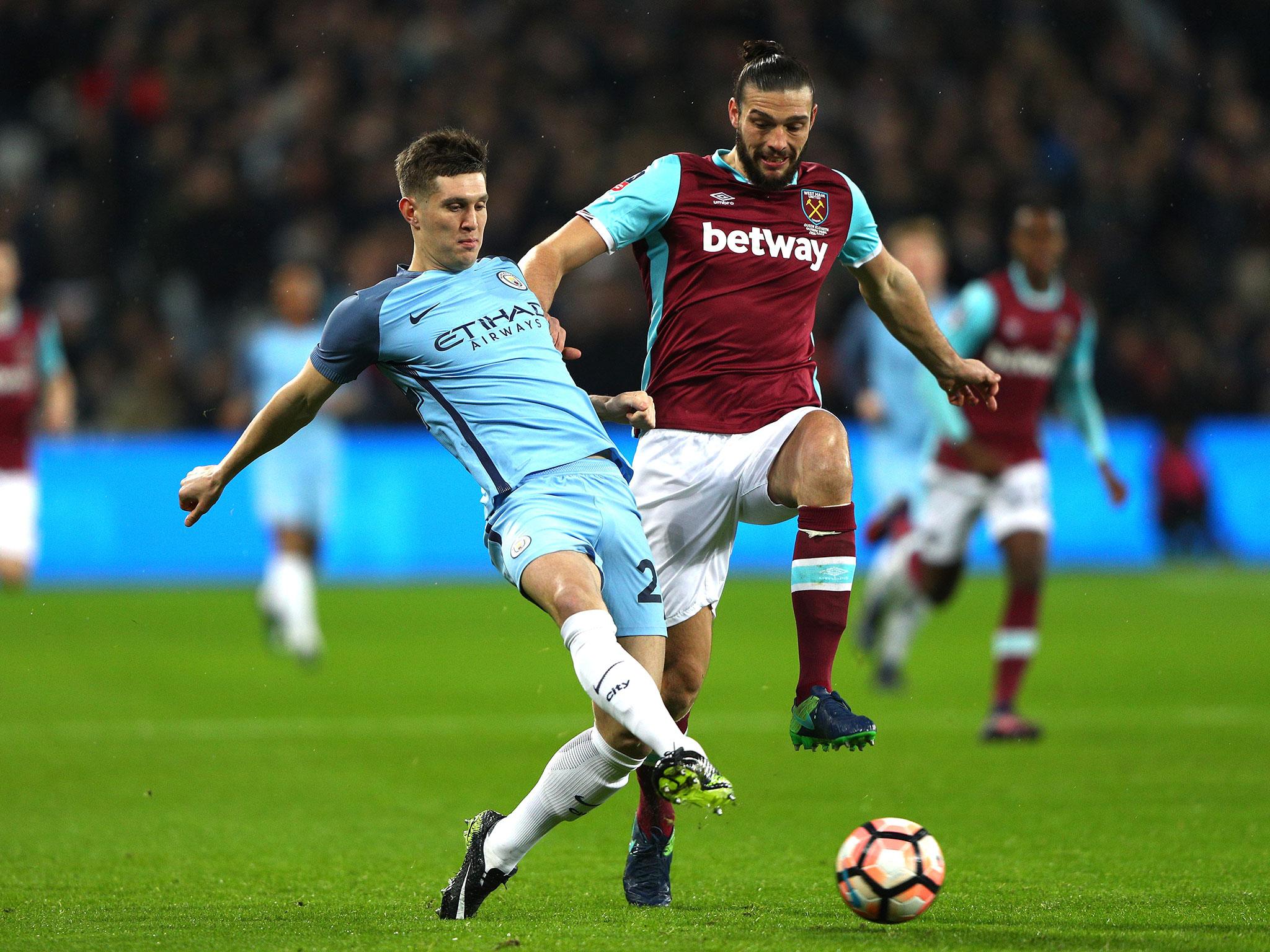 John Stones puts in a challenge on Andy Carroll