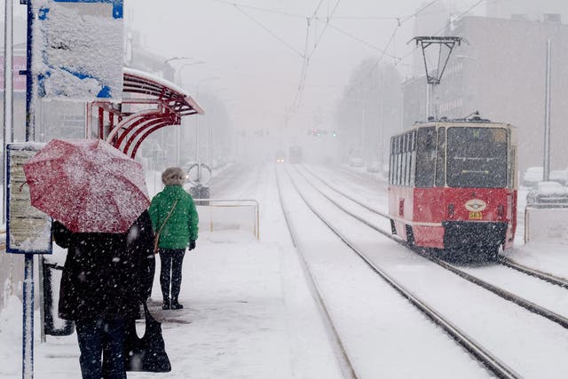 Pedestrians making their way during a heavy snowfall in Katowice, Silesia, southern Poland, 04 January 2017.