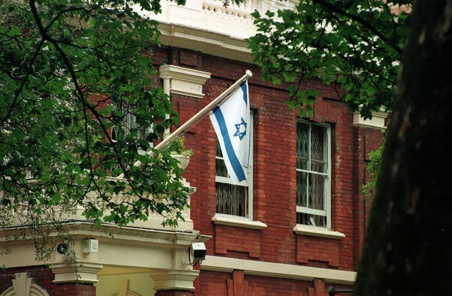 An Israeli flag flies at the Israeli Embassy in Kensington