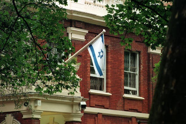 An Israeli flag flies at the Israeli Embassy in Kensington