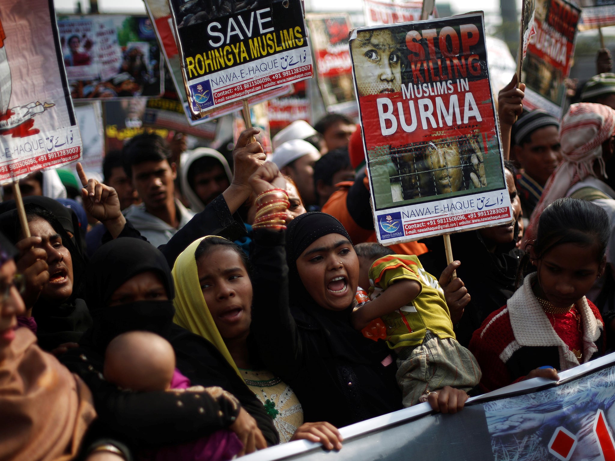 Rohingya Muslim refugees shout slogans during a protest against what organisers say is the crackdown on ethnic Rohingyas in Myanmar