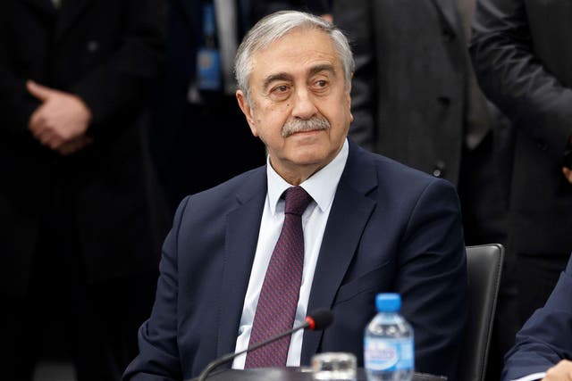 Turkish-Cypriot leader Mustafa Akinci waits for the start of a new round of Cyprus peace talks