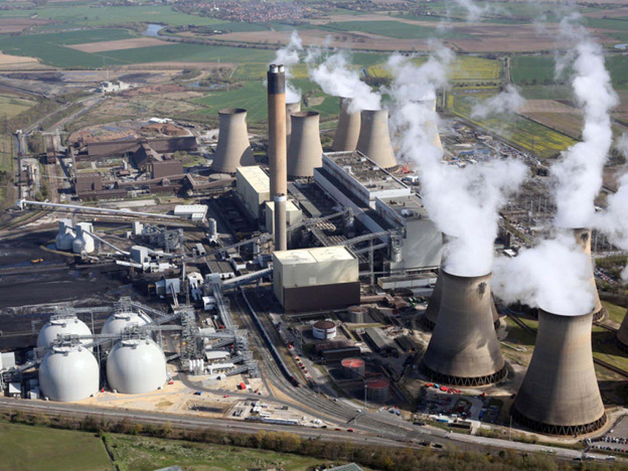 Drax’s new biomass domes, left in picture above, can store 300,000 tons of compressed wood pellets