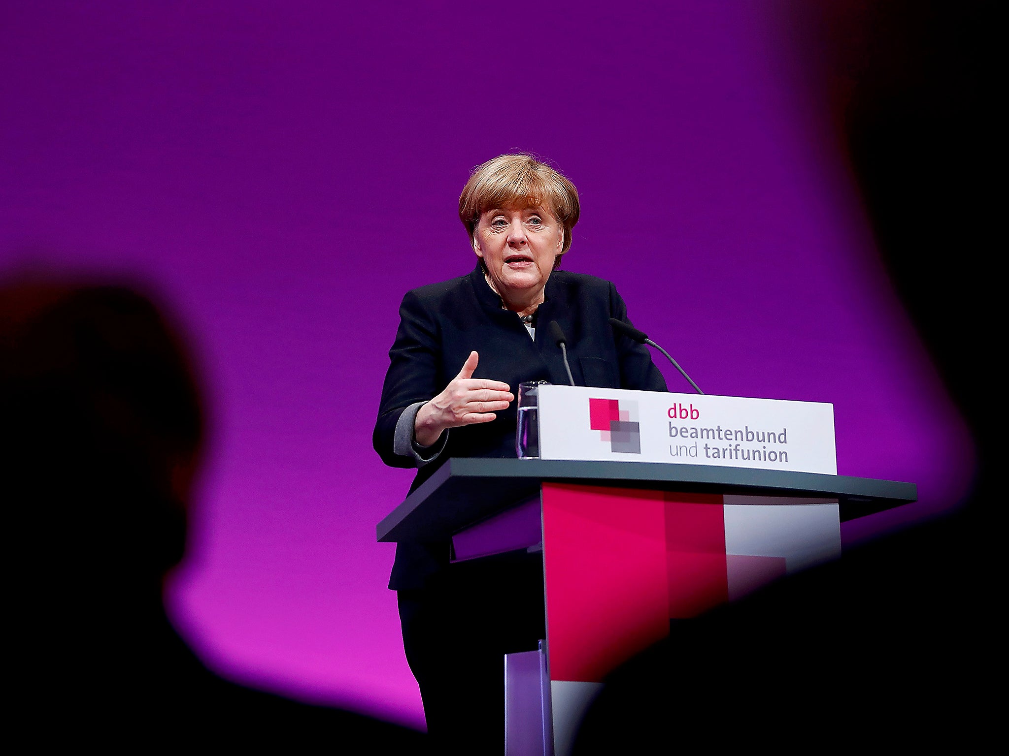 German Chancellor Angela Merkel delivers a speech during the yearly meeting of Germany's government workers union Deutscher Beamtenbund (dbb) in Cologne, Germany