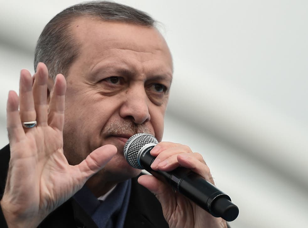 Turkish President Recep Tayyip Erdogan gestures as he delivers a speech on December 20, 2016 in Istanbul