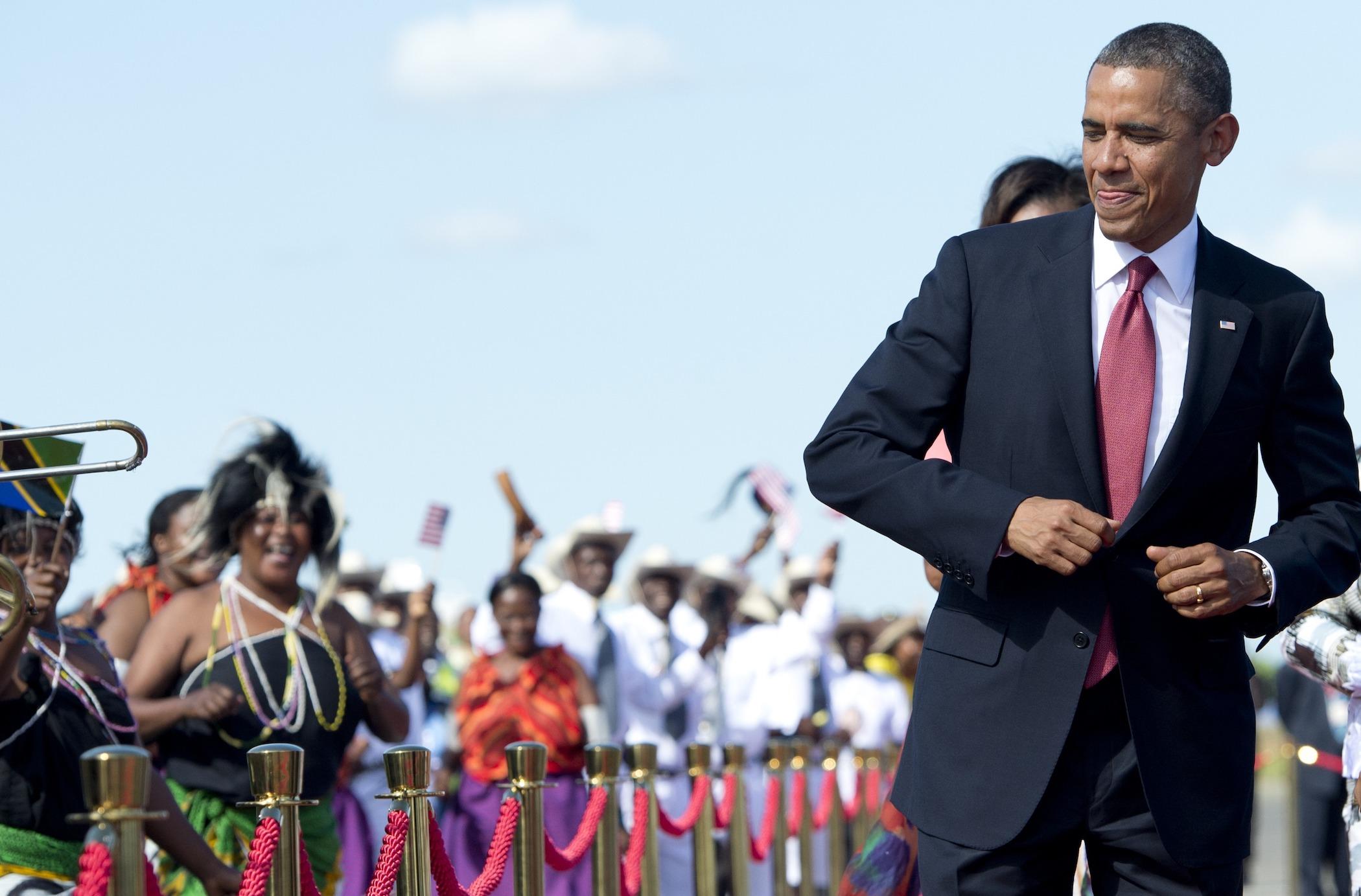 President Barack Obama dances to music upon arrival on Air Force One at Julius Nyerere International Airport in Dar Es Salaam, Tanzania, on July 1, 2013.