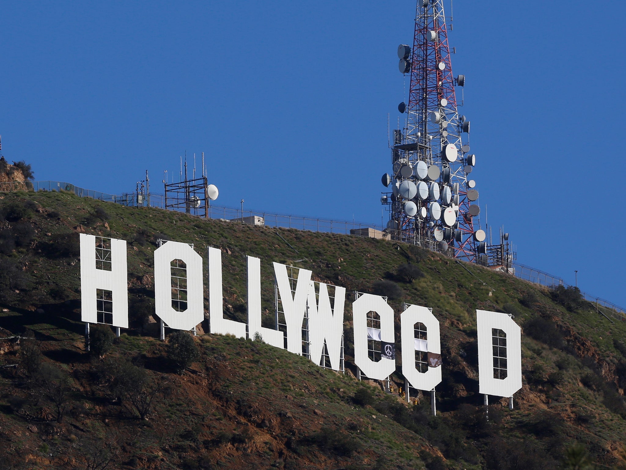Los Angeles residents awoke on New Year's Day to find a prankster had altered the famed Hollywood sign to read 'HOLLYWeeD'