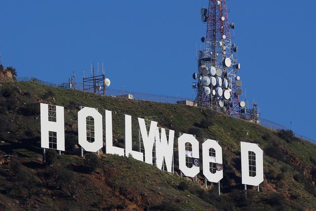 Los Angeles residents awoke on New Year's Day to find a prankster had altered the famed Hollywood sign to read 'HOLLYWeeD'