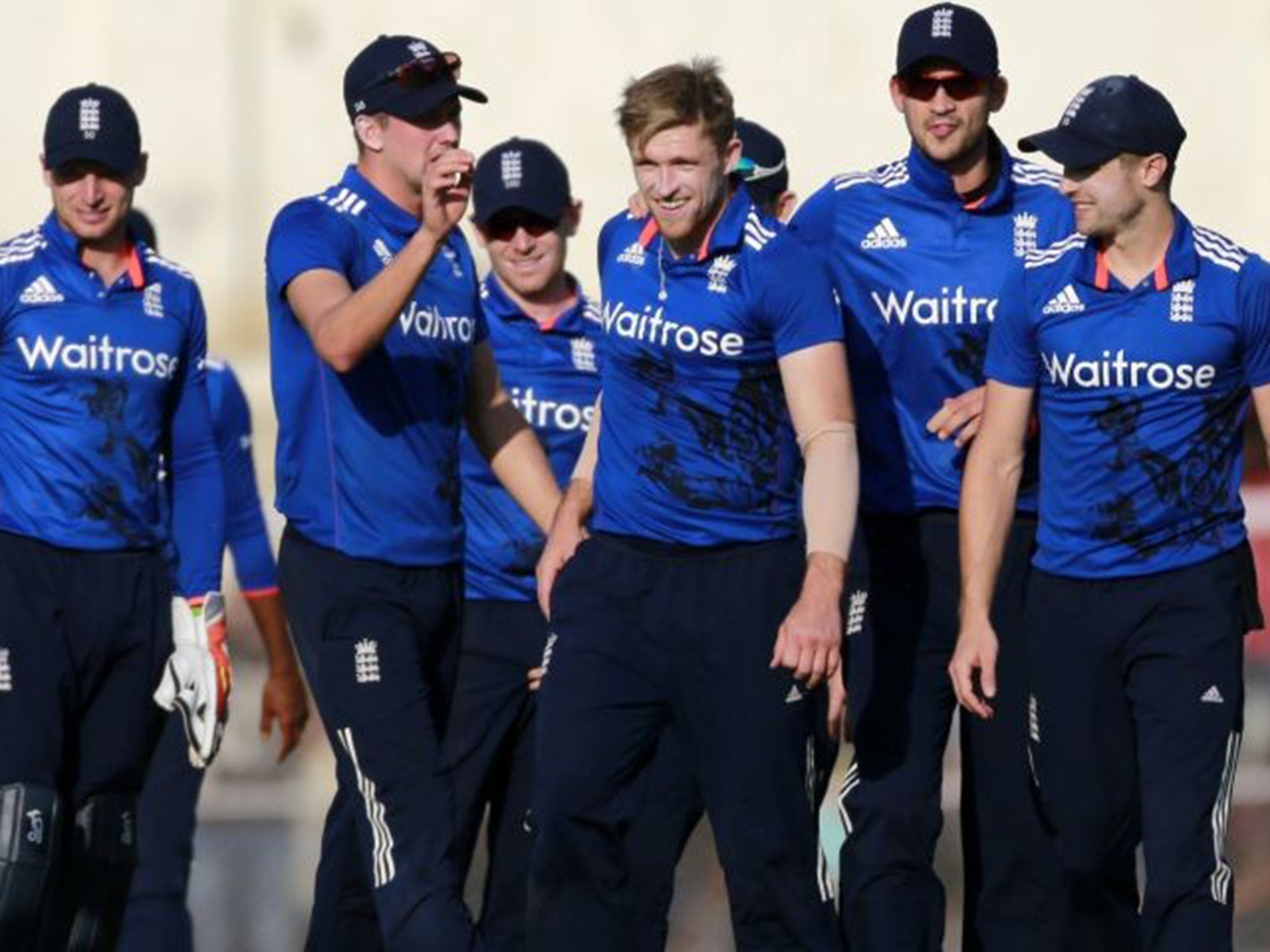 England celebrate after David Willey takes the wicket of Sanju Samson