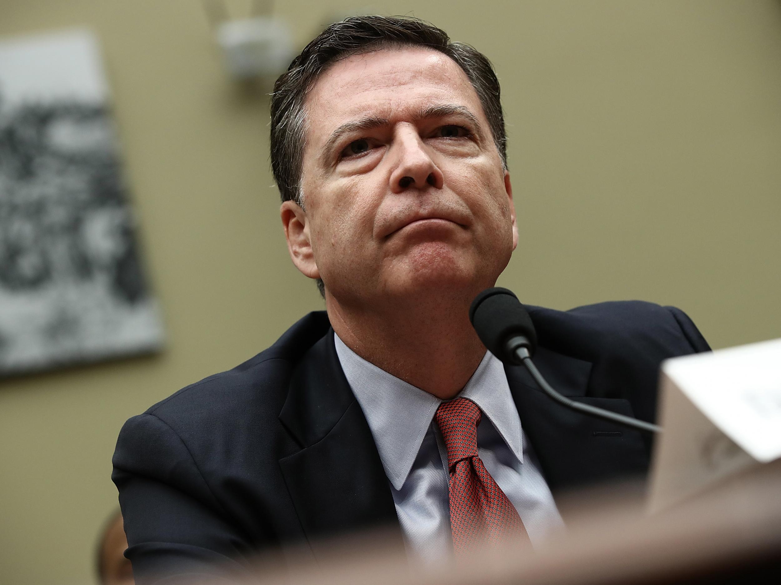 The FBI, headed by Republican James Comey, has been accused by Hillary Clinton's campaign manager of not calling out the Trump administration when the allegations first emerged