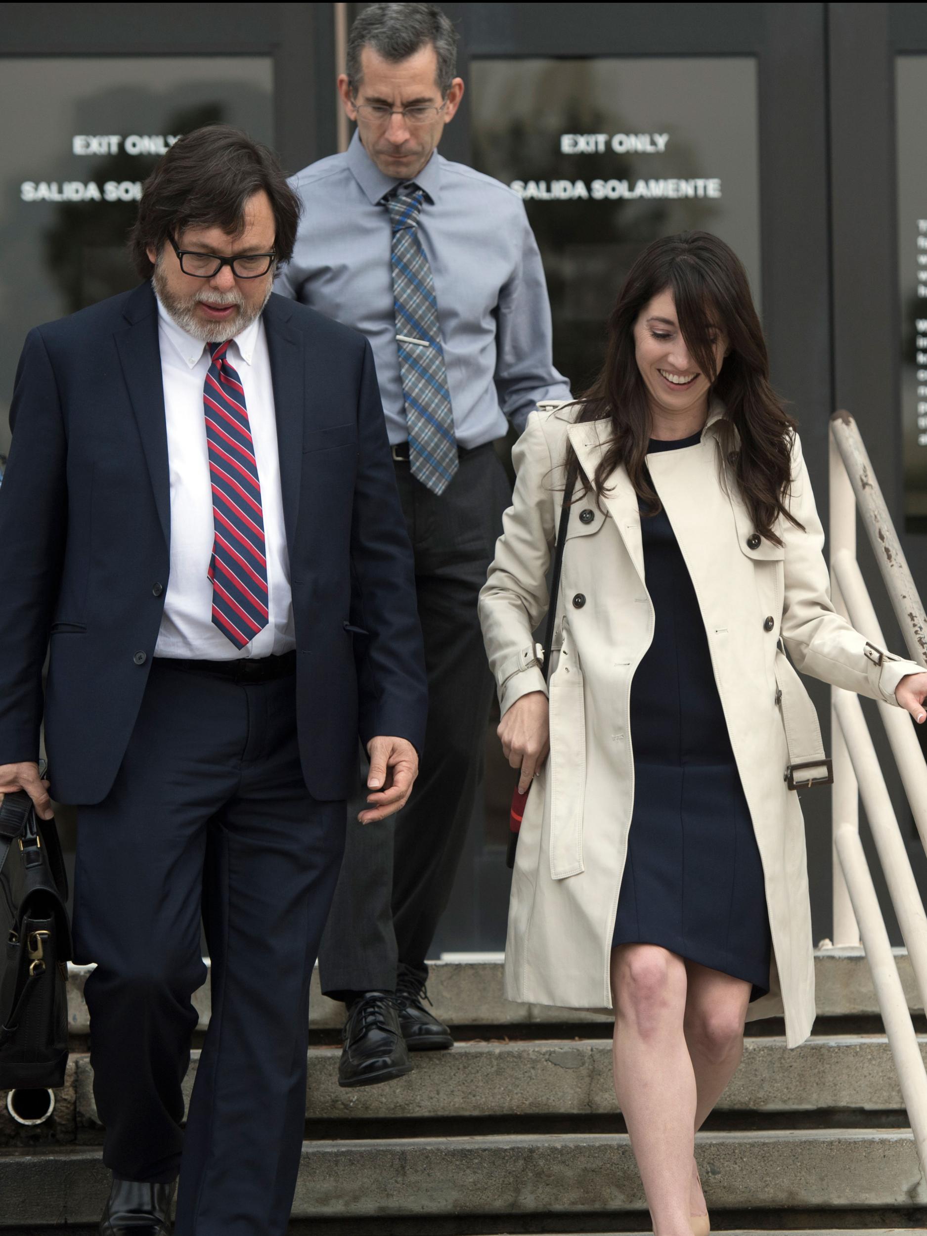 Michelle Hadley leaving court with her attorney Michael Guisti, left, and her father, Michael Hadley, behind her Jeff Gritchen/AP